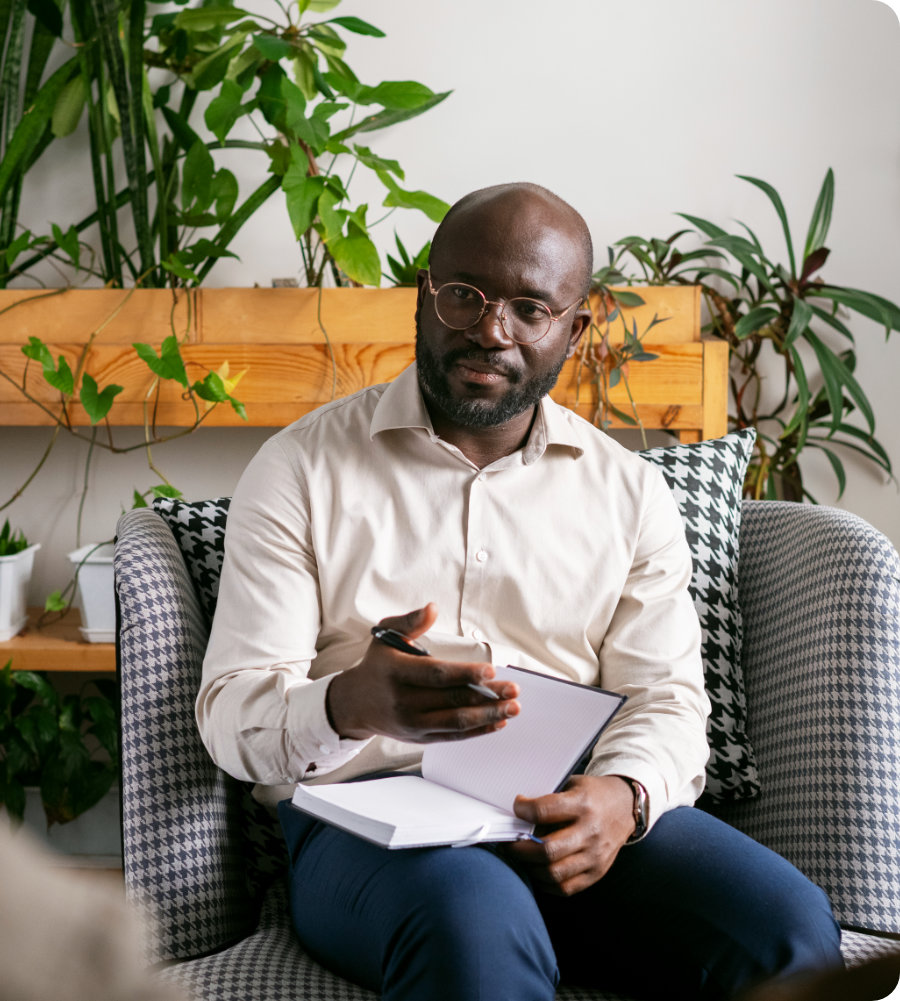 person sitting with notebook